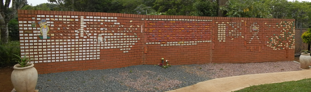 A 5-foot-tall wall of bricks that spans 20 yards and is painted with names of the patients who die here.